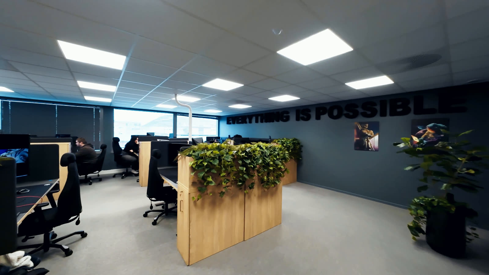 Open-plan engineering floor at Dynamic Engineering’s Drammen office, with the company slogan Everything is possible mounted on the wall